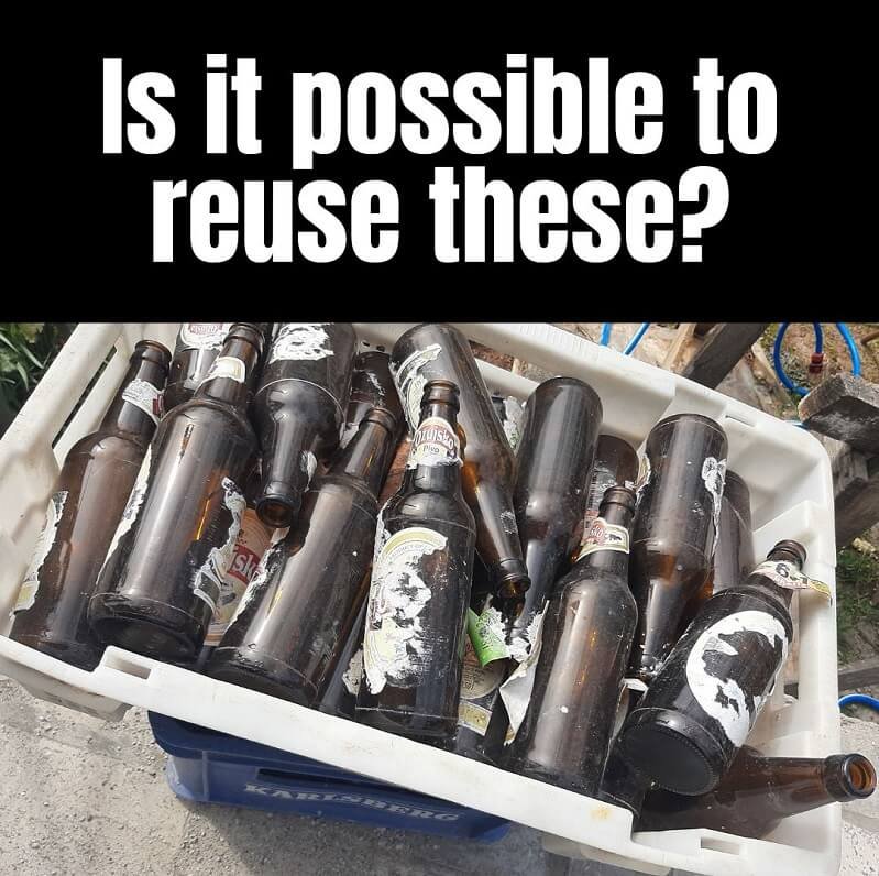 Dirty beer bottles and text "is it possible to reuse these?"